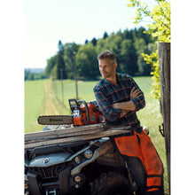 Load image into Gallery viewer, Husqvarna 455 Rancher and person in field
